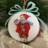 Christmas ornament Little girl with a gingerbread star
