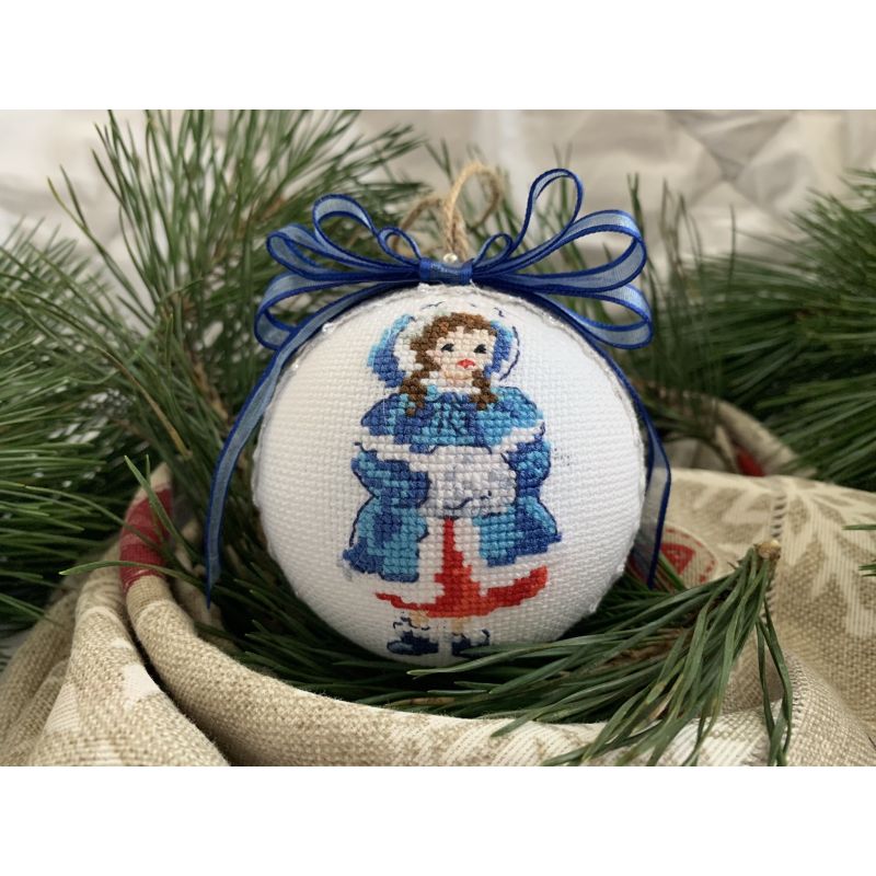 Christmas ornament Little girl in a blue coat